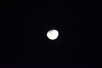 Low angle view of moon against sky at night