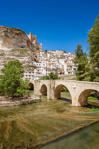 Arch bridge against blue sky