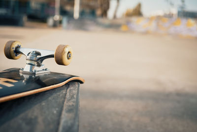 Close-up of skateboard on street