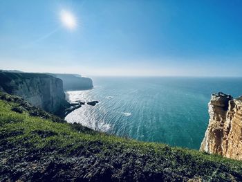 Scenic view of sea against sky on sunny day