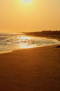 Scenic view of sea against clear sky during sunset