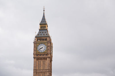 Low angle view of clock tower against sky