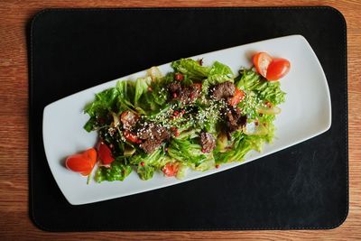 High angle view of salad served on table