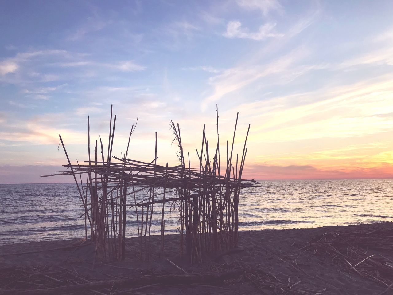 sky, water, sea, sunset, cloud - sky, scenics - nature, horizon over water, beauty in nature, beach, horizon, land, tranquility, tranquil scene, no people, nature, wood - material, non-urban scene, orange color, outdoors