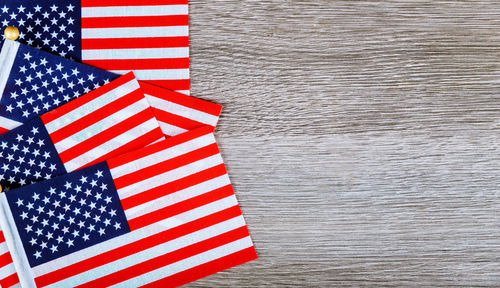 Close-up of american flags on table