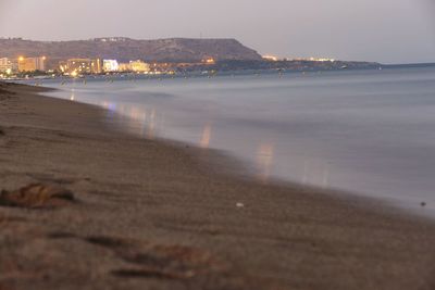 Scenic view of sea against sky at sunset