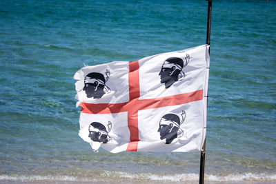 Flag on boat in sea