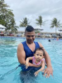 Portrait of boy swimming in pool