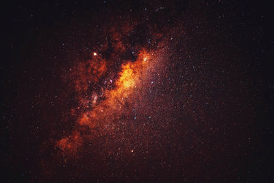 Low angle view of firework display at night