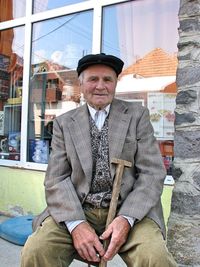 Portrait of man sitting outdoors