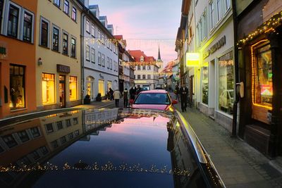 Buildings in city at sunset