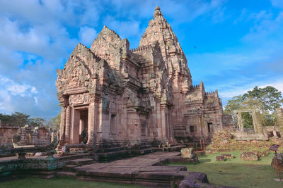 Old temple against cloudy sky