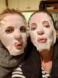 Close-up portrait of woman wearing mask