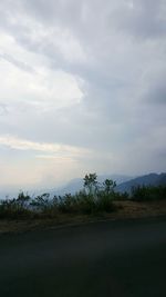 Scenic view of landscape against cloudy sky