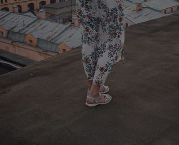 Low section of woman standing on floor