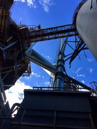 Low angle view of factory against sky