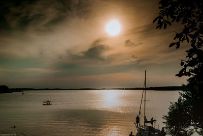 Silhouette of sailboats at sunset