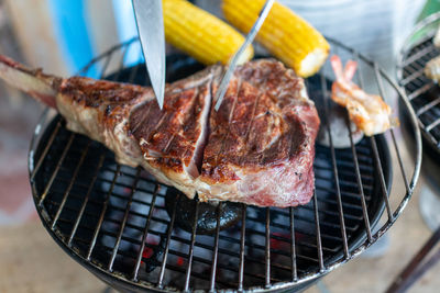 Close-up of meat on barbecue grill