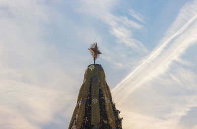 Low angle view of christmas tree against sky