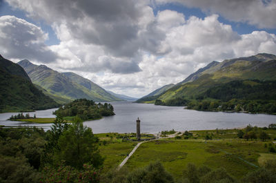 Scenic view of landscape and mountains against sky