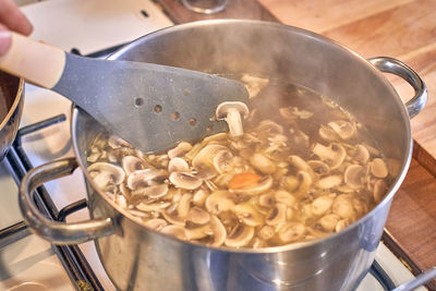 Close-up of person preparing food in kitchen