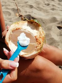 Midsection of person holding ice cream