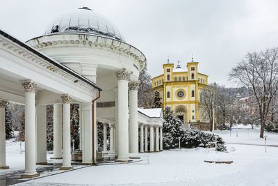 Historic building against sky during winter