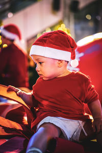 Portrait of woman sitting on sofa