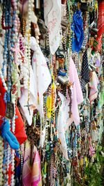 Colorful rosaries for sale at market stall