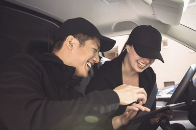 Men sitting in car