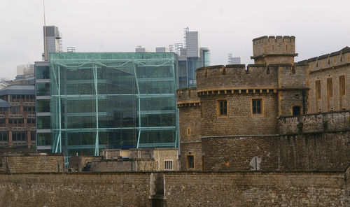 Buildings in city against sky