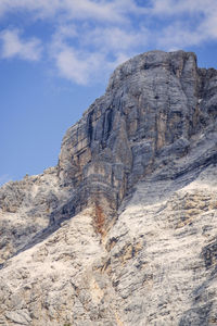 Low angle view of rock formations against sky on dolomites