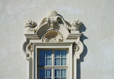 Low angle view of statue on building wall