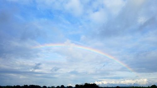 Low angle view of rainbow against sky