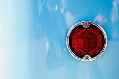 Cropped image of blue car with taillight