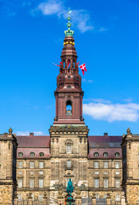 Low angle view of building against blue sky