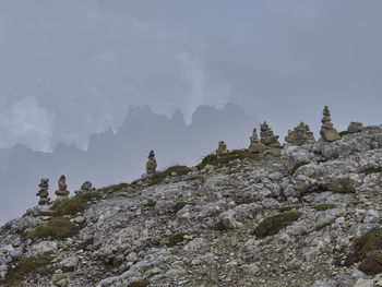 Rock formations on mountain against sky