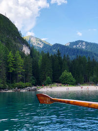 Scenic view of sea and mountains against sky