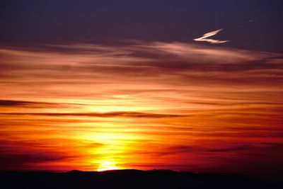 Scenic view of dramatic sky during sunset