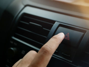 Close-up of hand using mobile phone