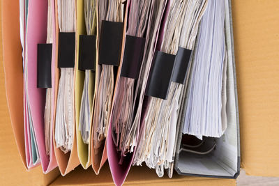 Directly above shot of files in cardboard box in office