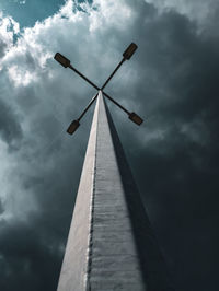 Low angle view of windmill against sky