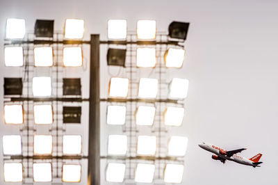 Low angle view of airplane flying against sky