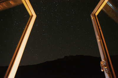 Low angle view of stars against sky at night