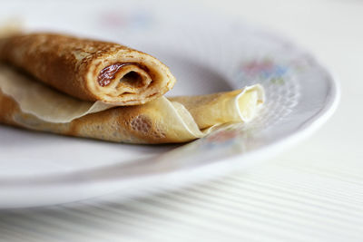 Delicious homemade pancakes with fruits and blur background on the table