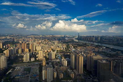 High angle view of city buildings against sky