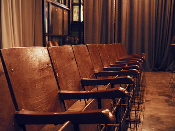 Close-up of empty chairs on table