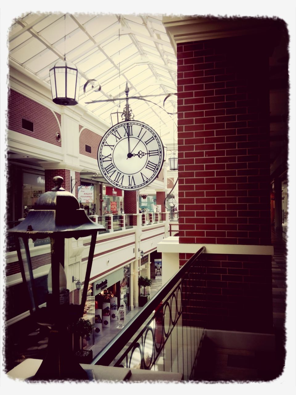 transfer print, architecture, built structure, auto post production filter, building exterior, city, window, building, day, city life, indoors, communication, incidental people, transportation, street, clock, clear sky, railing, glass - material