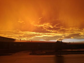 Scenic view of dramatic sky over sea during sunset