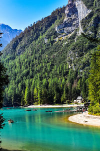 Scenic view of lake and mountains against sky